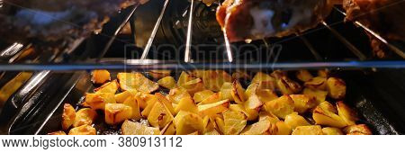 Closeup Of Fried Chicken Legs With Potato Chips Baked In Oven. Appetizing Roast Turkey. Delicious Me