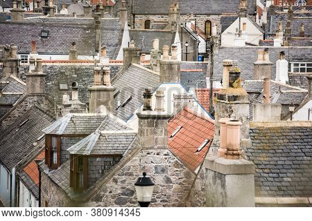 Old Croft Houses In Cullen, Fishing Village On Moray Firth, Scotland. Cullen Viaduct In The Backgrou