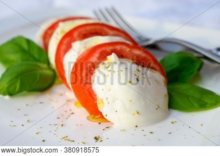 Fresh Caprese Salad Made With Soft White Italian Cheese Mozzarella Buffalo, Green Basil, Red Tomatoe