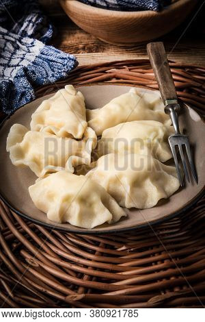 Homemade Dumplings With Cheese On A Plate.