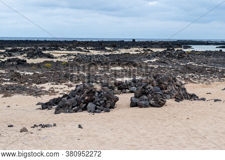 Human Nest Made With Volcanic Rocks To Protect From The Wind On Caleton Blanco Beach, Lanzarote, Can