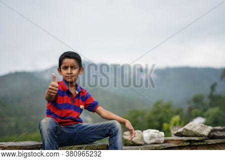 Portrait Of A Indian Pahadi Kid Who Belongs To The Mountains.