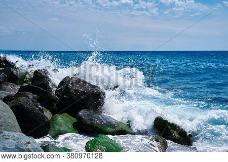 The Coastal Landscape Of The Imeretinskaya Adler Beach With The Evening Light, When The Waves Break 