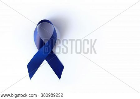 Blue Ribbon On A White Background Is A Symbol Of The Problem Of Stevens-jones Syndrome, Colon Cancer