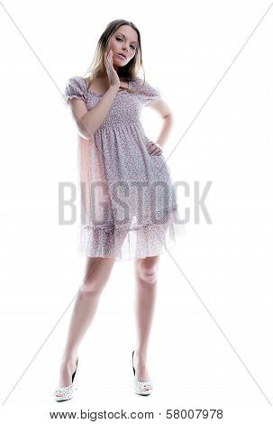 Attractive young woman posing in motley sarafan