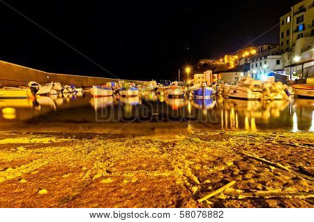 night view of ancient port in Piombino, Tuscany