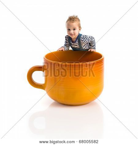 Kid Inside Ceramic Cup Over White Backgrpund