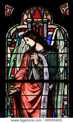 PARIS, FRANCE - NOV 11, 2012: Angel, stained glass from Church of St-Germain-l'Auxerr ois founded in the 7th century, was rebuilt many times over several centuries. 