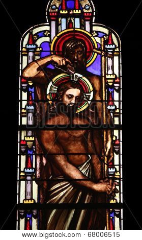 PARIS, FRANCE - NOV 11, 2012: Baptism of the Lord, stained glass from Church of St-Germain-l'Auxerr ois founded in the 7th century, was rebuilt many times over several centuries. 