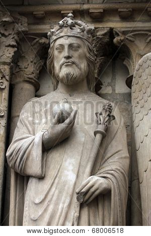 PARIS,FRANCE - NOV 05, 2012: Emperor Constantine, architectural details of Notre Dame cathedral. The Portal of the Virgin, dedicated to the patroness of the cathedral, was sculpted in the 1210s-1220s.