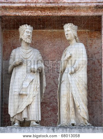 PARMA, ITALY - MAY 01, 2014: Saints, marble statue on the baptistry from Benedetto Antelami. Baptistery in Parma is considered to be among the most important Medieval monuments in Europe.