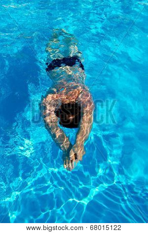 Man Swims Breaststroke Under Water In The Pool