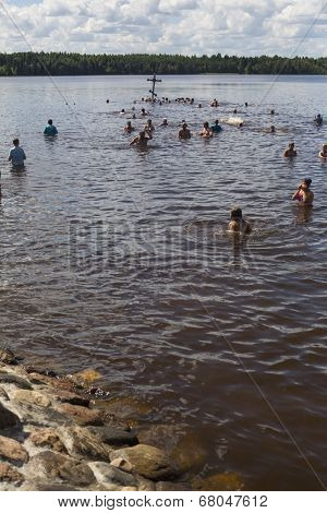 KRASNY BRONEVIK, RUSSIA - JULY 7, 2014: Celebrations commemorating the Rev. Anthony Dymsky (died 1224) in Antony Dymsky Monastery - Procession on Lake Dymsky, the great blessing of water and bathing.