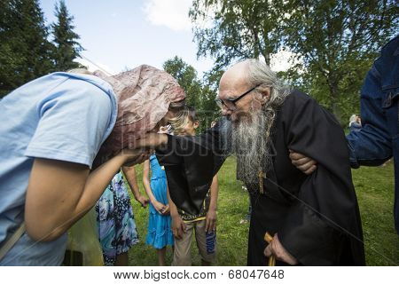 KRASNY BRONEVIK, RUSSIA - JULY 7, 2014: Celebrations commemorating the Rev. Anthony Dymsky (died 1224) in Antony Dymsky Monastery - Procession on Lake Dymsky, the great blessing of water and bathing.