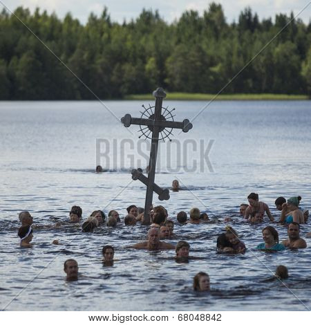 KRASNY BRONEVIK, RUSSIA - JULY 7, 2014: Celebrations commemorating the Rev. Anthony Dymsky (died 1224) in Antony Dymsky Monastery - Procession on Lake Dymsky, the great blessing of water and bathing.