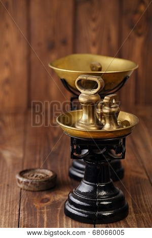 Vintage cast iron kitchen  scale with weights on old wooden table