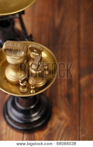 Vintage cast iron kitchen  scale with weights on old wooden table