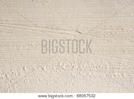Ecru Rough Plaster On Wall Closeup