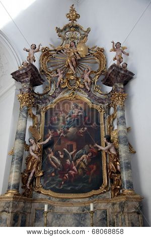 WURZBURG, GERMANY - JULY 18: Madonna with Child, altar in the Neumunster Collegiate Church, built in 1060 and completely renovated in the 17th century and since 1908 the parish church on July 18,2013.