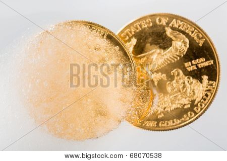 Golden Eagle Coin Emerging From Deep Freeze