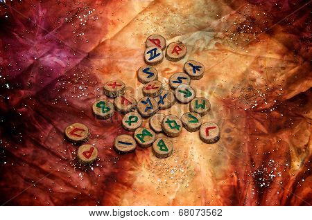 Wooden Viking Runes On Colorful Mystical Cloth