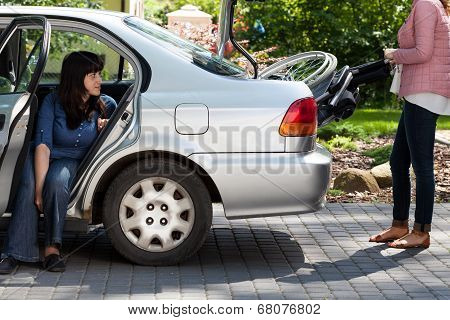 Girl Taking Wheelchair From Car