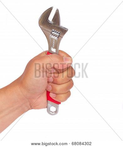 hand holding ajustable wrench