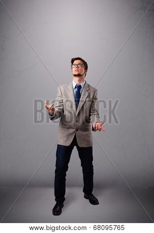 funny man standing and juggling with copy space