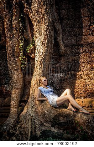 young woman relax under the tree