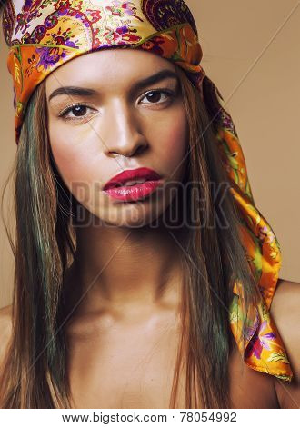 beauty young afro american woman in shawl on head smiling close up