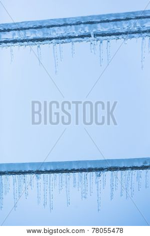 Icicles On Electricity Power Lines
