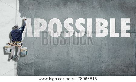 Building painter overwriting the beginning of the word impossible so that it becomes possible 
