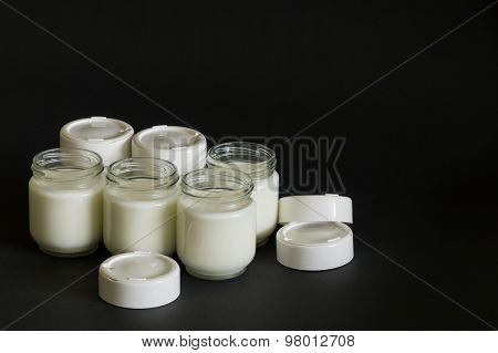 Jars with milk without cover