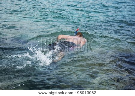 Man Snorkeling In Clean Waters
