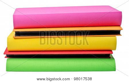 The Pile Of Colored Photo Albums On Wite Backround