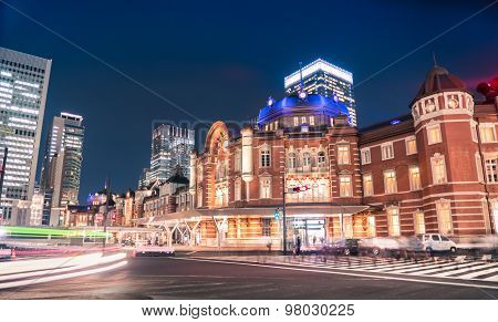 Traffic And People Crossing The Street Outside The Historic Tokyo Station, Tokyo