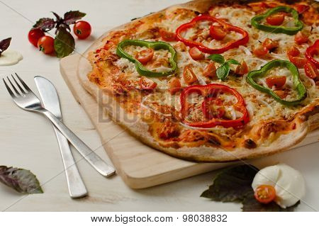 Delicious, Freshly Baked, Homemade Italian Pizza With Peppers, Onions And Tomatos