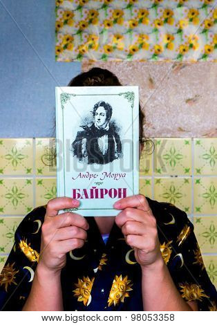 GOMEL, BELARUS - AUGUST 2, 2015: Girl holding a book by Andre Morua 