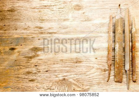 Various Different Steel Retro Rusty Rasp File Tool Collection Isolated On Wooden Background. Copy Sp
