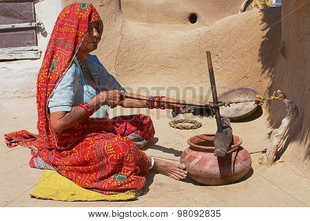 Blind woman does housework in Jamba, India.