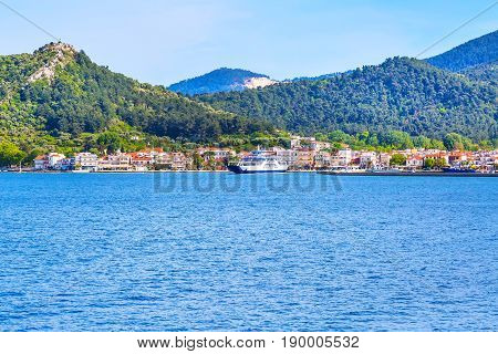 Thassos, Greece - May 1, 2016: Thassos port and town view with ferry boat