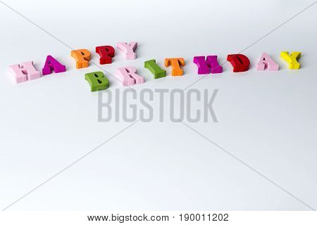 The Word Happy Birthday On A White Background