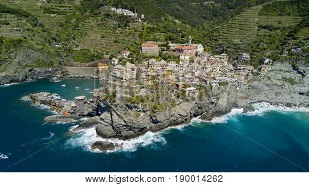 Aerial footage with drone on Vernazza, one of the famous Cinqueterre country, small village with colored houses on the cliff over the sea