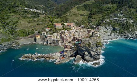 Aerial footage with drone on Vernazza, one of the famous Cinqueterre country, small village with colored houses on the cliff over the sea
