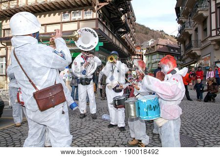 People Performing Gugge Music At The Carnival Of Engelberg