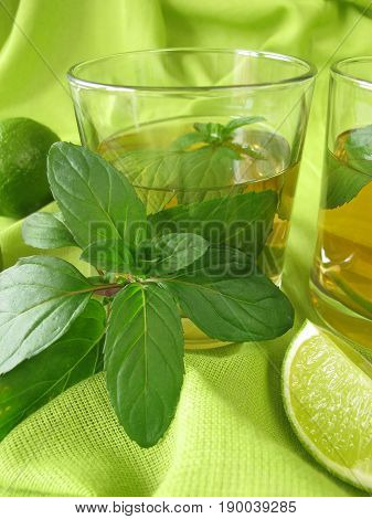 Glass of homemade ice tea with lemon mint