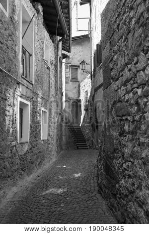 Asso (Como Lombardy Italy): typical street in the historic town. Black and white