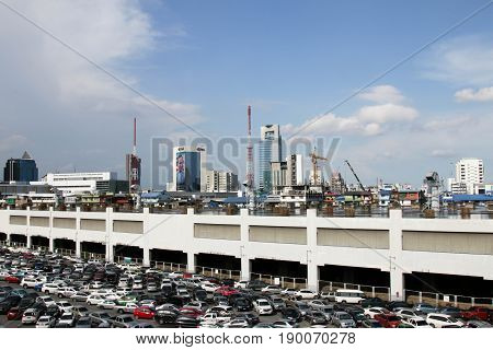 BANGKOK, THAILAND - JUNE 3, 2017 : parking lot and skyline next to Chatuchak Market.