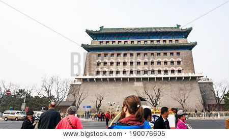 Tourists On Street And View Of Arrow Tower