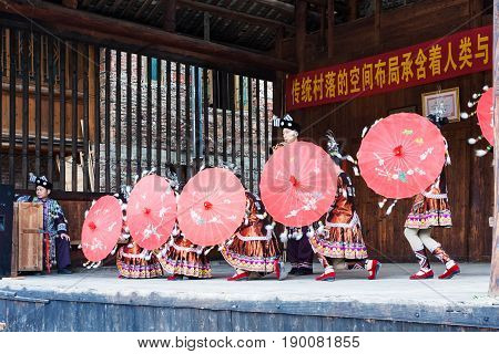Dancers With Umbrellas In Dong Culture Show